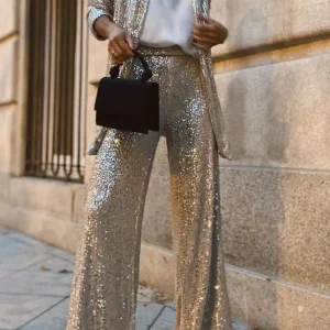Kiara - Elegante completo con giacca aperta di paillettes e pantaloni a gamba larga